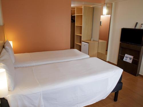ibis Maceio Pajuçaraにあるベッド