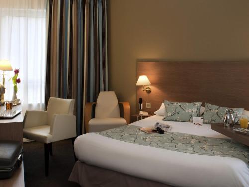 Postel nebo postele na pokoji v ubytování Mercure Hotel Forbach Centre de Loisirs