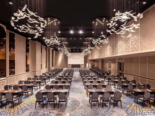 a large banquet hall with tables and chairs at Sofitel Saigon Plaza in Ho Chi Minh City