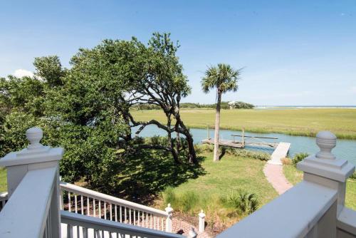 a view from the balcony of a house with a river at Moonrise Point in Edisto Island