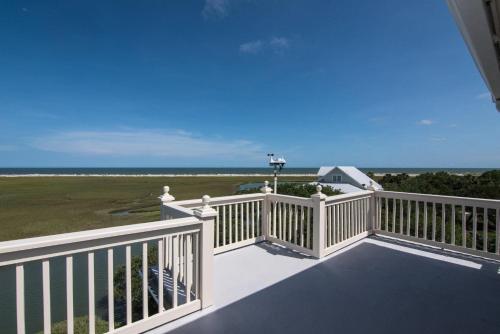 a balcony with a view of the ocean at Moonrise Point in Edisto Island