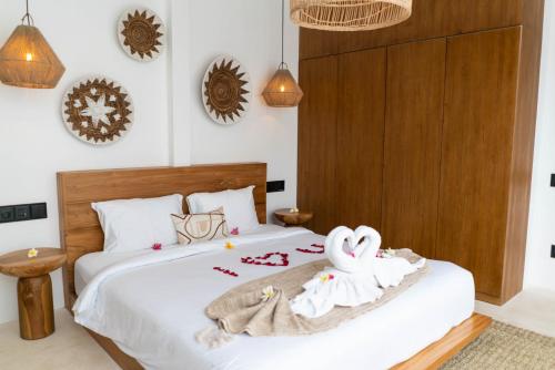 Ένα ή περισσότερα κρεβάτια σε δωμάτιο στο Ubud Dzen Villa 7