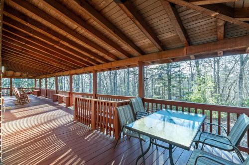 a screened in porch with a table and chairs on it at Eagles Rest in Fleetwood