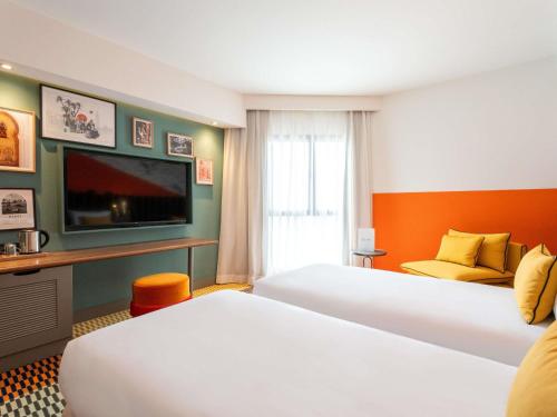 Кровать или кровати в номере Mercure Shéhérazade Rabat