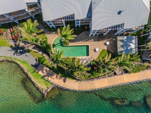 an aerial view of a house with a swimming pool at Sunrise Cove 25 in Kingscliff