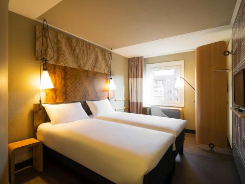 Кровать или кровати в номере ibis Amsterdam Centre Stopera