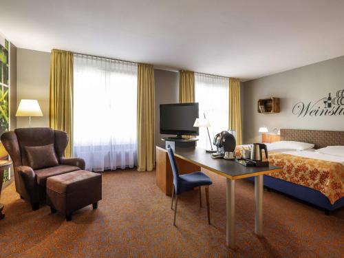 TV a/nebo společenská místnost v ubytování Mercure Hotel & Residenz Berlin Checkpoint Charlie
