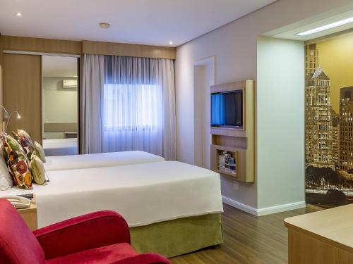 Телевизор и/или развлекательный центр в Mercure São Paulo Nações Unidas