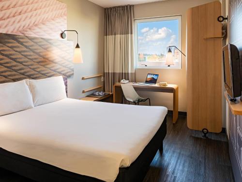 Кровать или кровати в номере ibis Ribeirao Preto Shopping