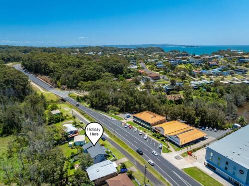 an aerial view of a city with a road at Skyes Beach House-Views, Spas, Sauna, Arcade Games in Surf Beach