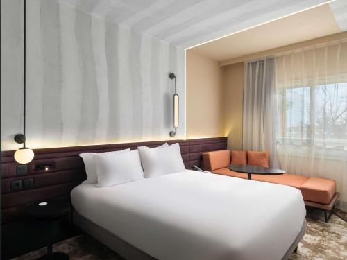 Кровать или кровати в номере Novotel Cairo 6th Of October
