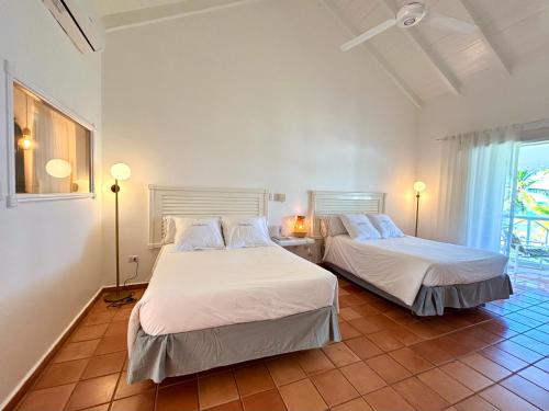 Postel nebo postele na pokoji v ubytování Hotel TODOBLANCO, Las Galeras, SAMANA