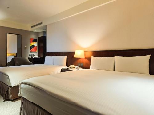 Cama o camas de una habitación en 雀客旅館台中來來