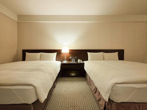 Cama o camas de una habitación en 雀客旅館台中來來