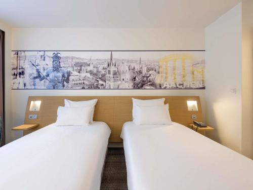 Кровать или кровати в номере Novotel Aachen City