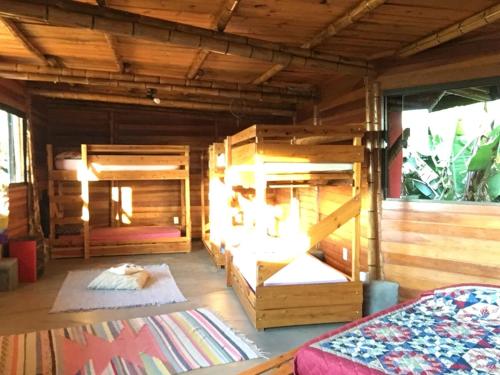 a large room with two bunk beds in it at Sitio Mangala in Itapeva