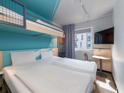 Giường trong phòng chung tại ibis budget Hamburg St Pauli Messe - neu renoviert