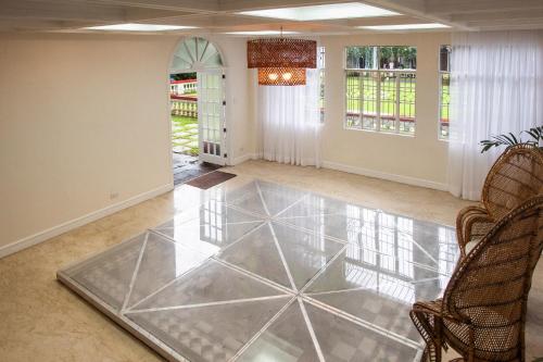 a living room with a glass floor at MIRANAMIN NEST Elegant Home, Indoor Plunge Pool, Pet-Friendly, with Rooftop, Kitchens, Self-Service Breakfast - Ideal for Reunions, Team Building, Intimate Gatherings in Manila