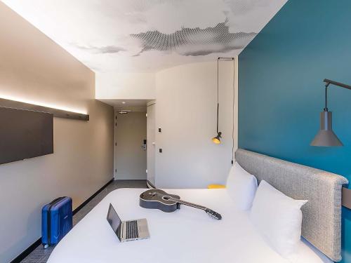 Кровать или кровати в номере Hotel ibis Lisboa Alfragide