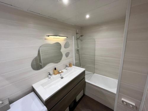 a bathroom with a sink and a shower at Appartement chaleureux près des pistes à Méribel - FR-1-688-100 in Mussillon