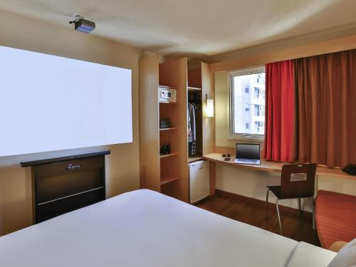 Кровать или кровати в номере ibis Sao Paulo Morumbi