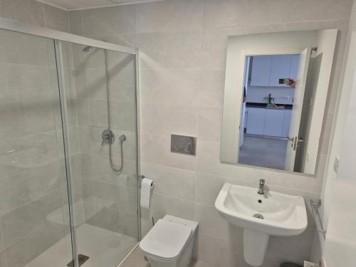 a bathroom with a toilet and a sink and a shower at Apartamento moderno y lujoso con aire acondicionado en San Juan de los Terreros - ES-376-42 in El Pozo del Esparto