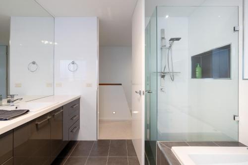a bathroom with a shower and a sink at Relaxed Family Stay Walk to Beach in Ocean Grove