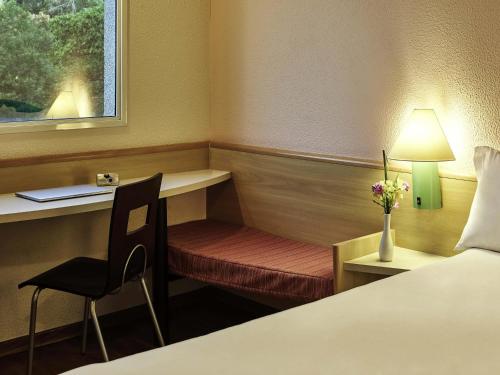 ibis Santo Andreにあるベッド
