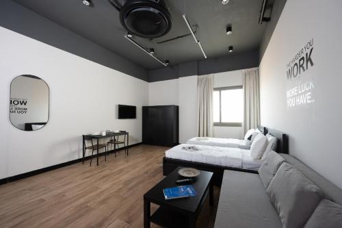 a living room with a couch and a table at Quiet Studio Studio by Spacey in Duqm 84 in Duqm