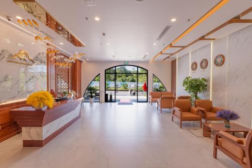 a lobby of a hospital with chairs and a waiting room at Golden Mountain Hotel Phu Quoc in Phú Quốc