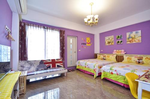 Un pat sau paturi într-o cameră la Dreamer 24 B&B
