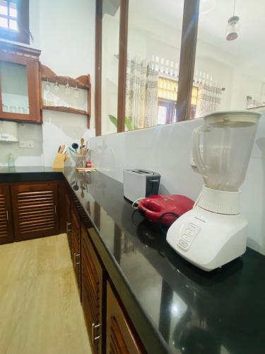 a blender sitting on a counter in a kitchen at Villa 2A in Matara