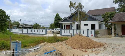 a house under construction with a pile of dirt at Damai Homestay, Kg Bukit, Terengganu in Kuala Terengganu
