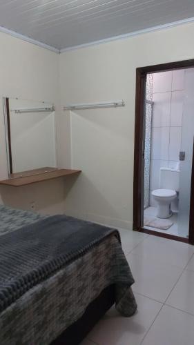 Ένα μπάνιο στο Apartamento Tucano