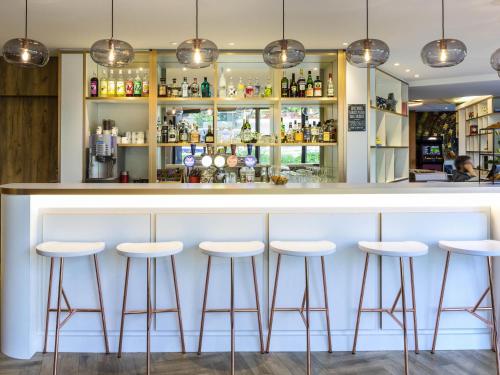 El salón o zona de bar de ibis Genève Petit Lancy