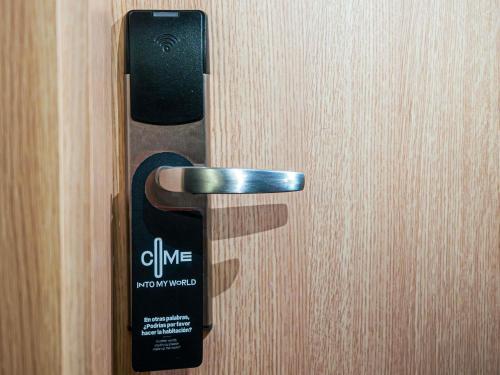 a close up of a remote control on a door at ibis Medellin in Medellín