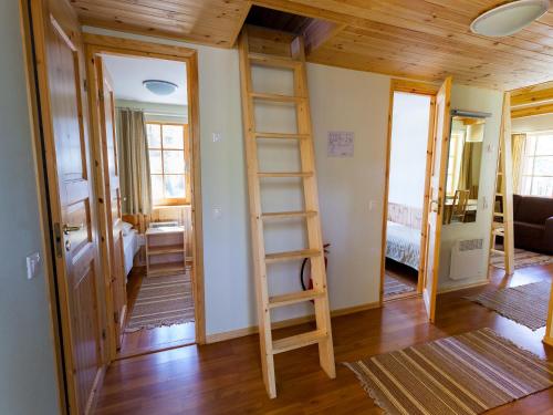 a room with a ladder in the middle of a room at Roosta Holiday Village in Elbiku