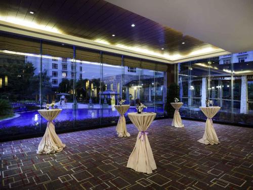 a row of tables in front of a building at Pullman Zhangjiajie Hotel - Instagrammable in Zhangjiajie