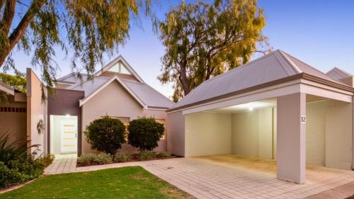 a house in the suburbs with a garage at FiftyTwo at Cape View in Busselton