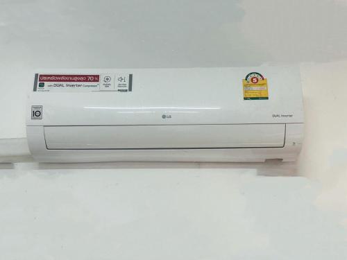 a white printer sitting on top of a wall at Beanstay hostel in Phuket Town