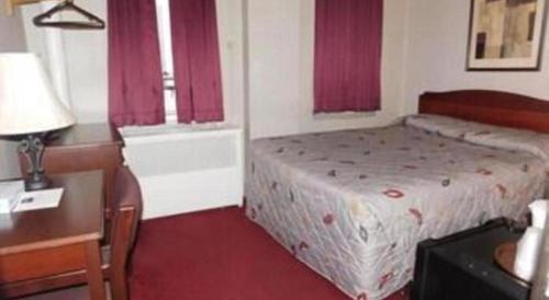 Ένα ή περισσότερα κρεβάτια σε δωμάτιο στο Hotel Harrington