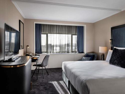 Кровать или кровати в номере Pullman Auckland Hotel & Apartments