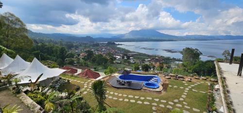 an aerial view of a resort with a body of water at Adelisca Glamping, Cafe and Villa in Kubupenlokan