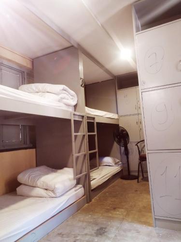 a group of bunk beds in a room at Heranya hostel in Jawlakhel