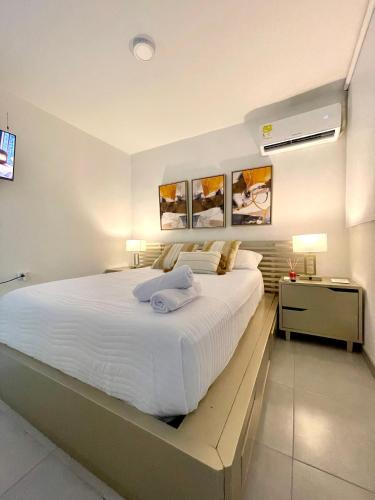 Кровать или кровати в номере Exclusivo apto con vista al mar a 5 min del centro histórico