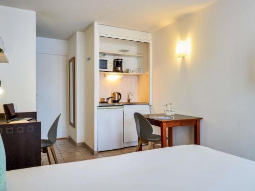 Kuchyň nebo kuchyňský kout v ubytování Aparthotel Adagio Access Nice Garibaldi