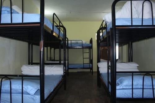 Postel nebo postele na pokoji v ubytování Universal Hotel & Lodge - Gorkha