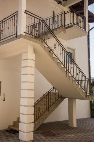 a spiral staircase in a building with a pillar at Apartmani Kastel in Banja Luka