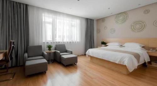 Ένα ή περισσότερα κρεβάτια σε δωμάτιο στο GreenTree Inn Wuhu Eshan Road University City