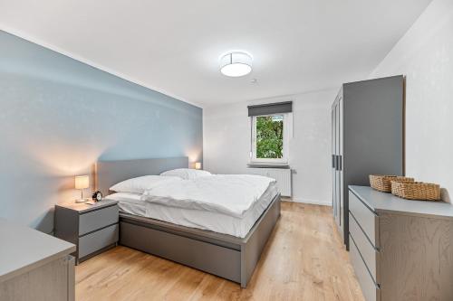 Ένα ή περισσότερα κρεβάτια σε δωμάτιο στο Work & Stay - Apartment mit Office